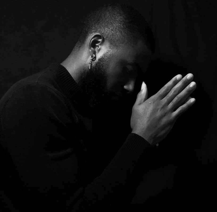 Man praying quietly