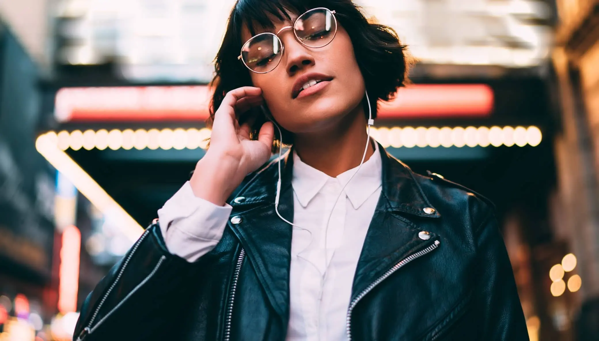Stylish woman listening music